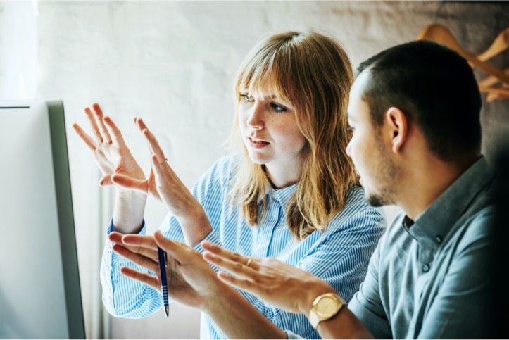Marketing team reviewing campaign and partner documents