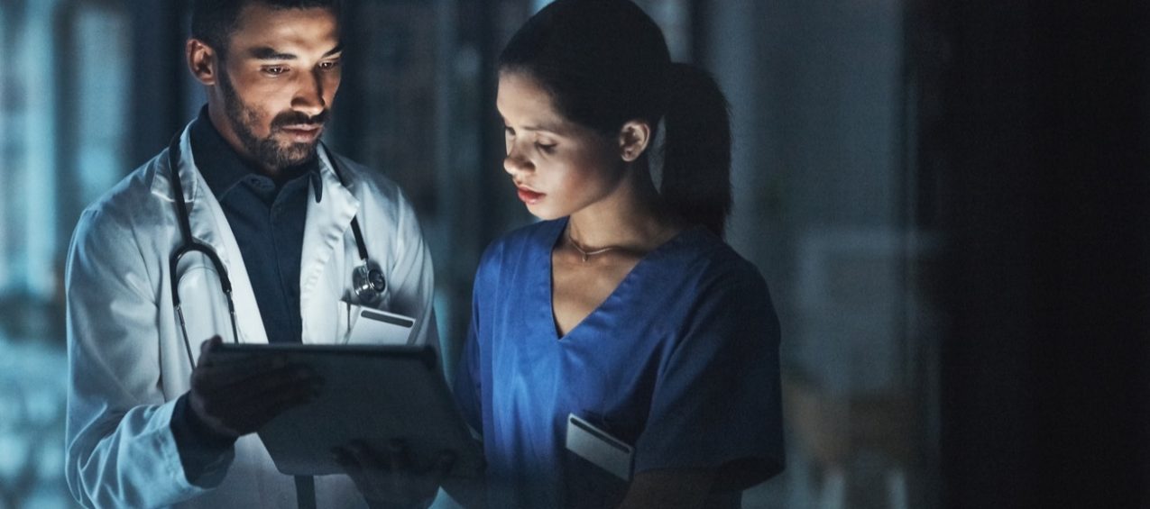Healthcare professionals reviewing a patient document together